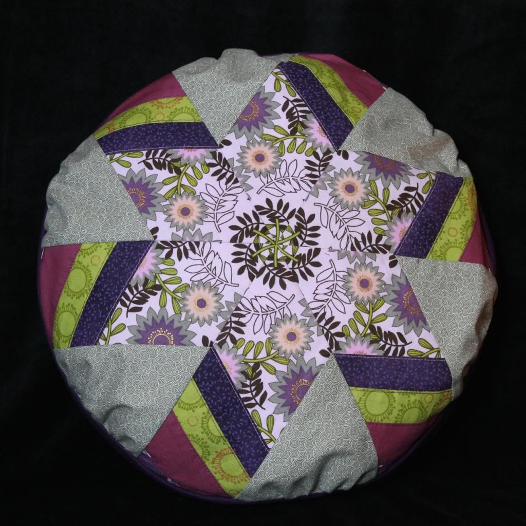 a pillow with a hexagonal pieced design