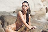  photo Kim-Kardashians-Rock-Hard-Beachwear-Shoot-01_zpse619e0ab.jpg